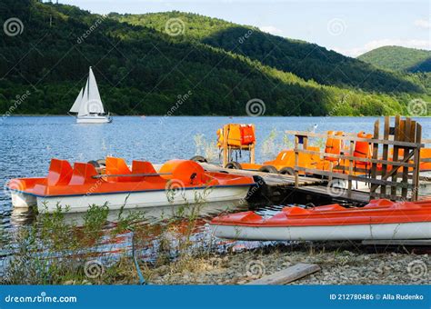 Orange Catamarans On Lake Moored At The Pier Hipster Lifestyle Active