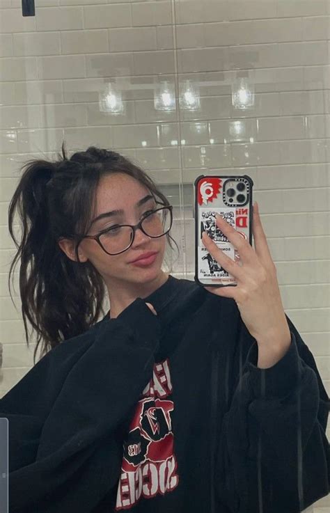 A Woman Taking A Selfie In The Bathroom