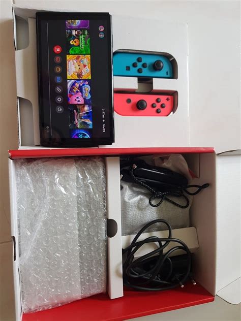 Nintendo Switch OLED Red Blue Video Gaming Video Game Consoles