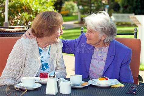 Cheerful Old Women Talking At The Outdoor Table Stock Image Image