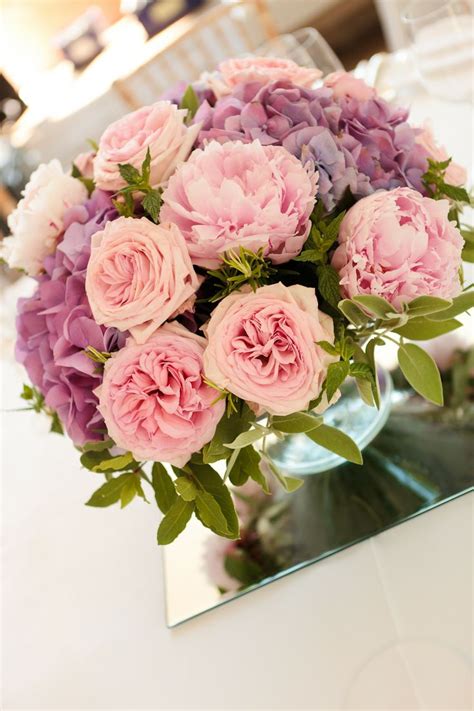 Summer Arrangement Of Peonies And Hydrangeas With Scented Herbs By