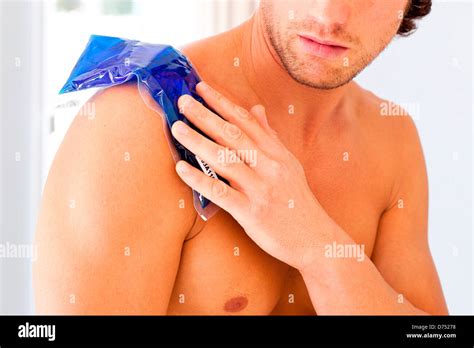 Man Using A Hot Cold Gel Pack Treatment To Releive Pain Stock Photo Alamy