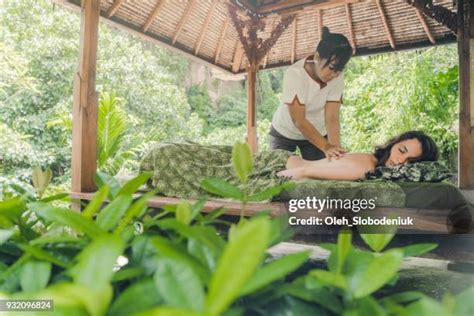 Woman Receiving Back Massage From A Massage Therapist Photos And