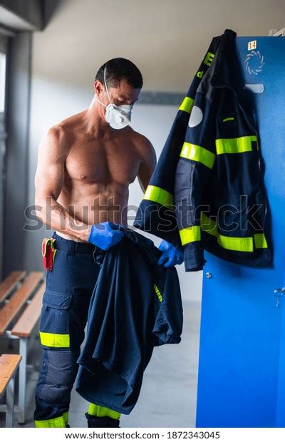 Serious Fireman Naked Torso Latex Gloves Stock Photo 1872343045