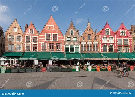 BRUGES, BELGIUM - MARCH 23, 2015. Tourists in North Side of Grote Markt ...