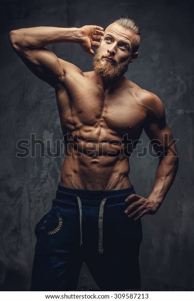 Shirtless Muscular Guy With Beard Showing His Great Body