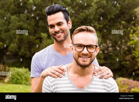 Smiling Gay Couple Hugging Stock Photo Alamy