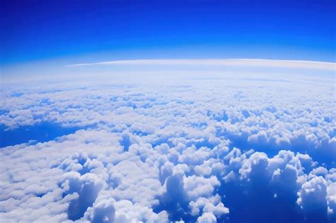 Premium Photo | View of the sky above clouds over the earth deep blue ...