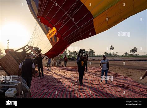 Team Prepares And Inflates A Hot Air Balloon For Sunrise Aerial Tour Of
