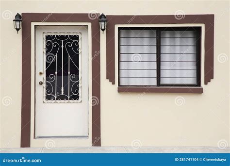 Entrance Of Residential House With White Door And Window Stock Photo