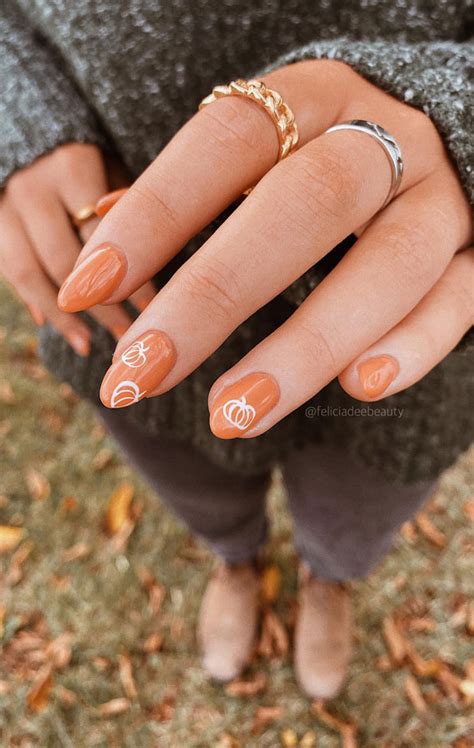 Charming Fall Nail Art To Adorn Your Tips White Outline Pumpkin Nails