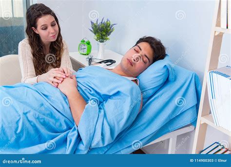 Wife Visiting Husband In Hospital Senior Couple Holding Hands On