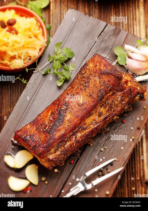 Rosted Ribs With Spices On Wooden Board Stock Photo Alamy