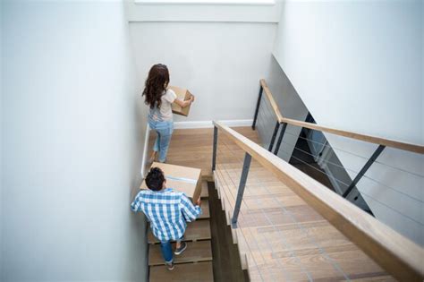 Premium Photo Rear View Of Couple Holding Cardboard Boxes