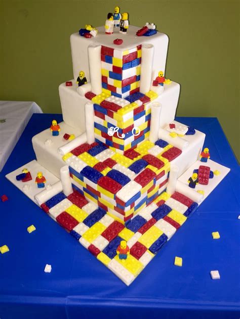 A Cake Made Out Of Lego Blocks On Top Of A Blue Table