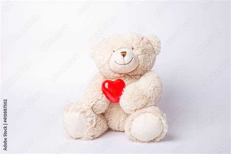 teddy bear holding heart isolated on white background Stock Photo ...