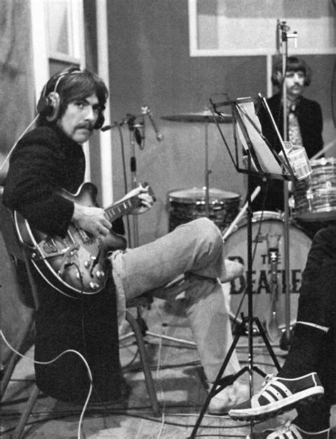 black and white photo of two men playing guitars in a recording studio ...