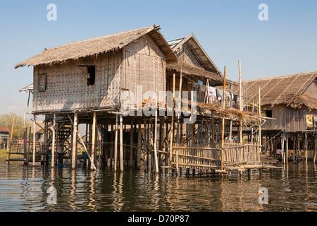 Basic Thatched Stilt Houses On The Flooded Sepik River Near Angoram In