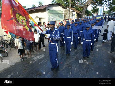 tamil youths members   rebel volunteer force march   flag