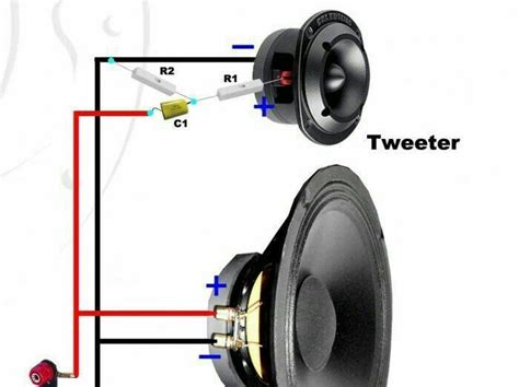 Two Speakers With Wires Connected To Each Other