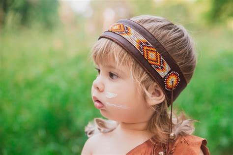 Premium Photo | Cute baby dressed in traditional native american costume