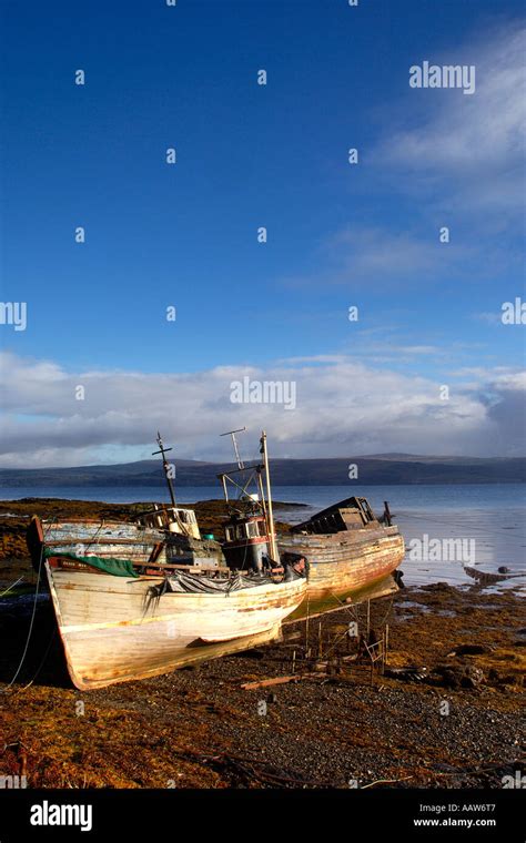 Three Derelict And Abandoned Boats Beached On The Shore Of Isle Of Mull