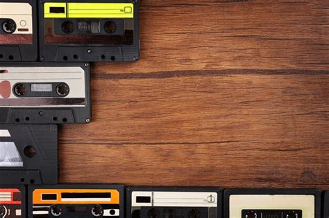 Premium Photo Collection Of Audio Cassettes On Wooden Table Copy Space