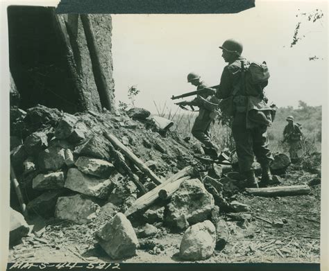 US soldiers cautiously approach the rubble of a house in Velletri ...