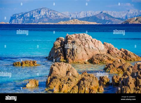 Clear Amazing Azure Coloured Sea Water On Capriccioli Beach With