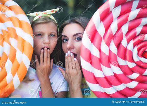 Blonde Mum With Her Daughter Surprised Holds Big Chupa Chups Stock Image Image Of Love Chupa