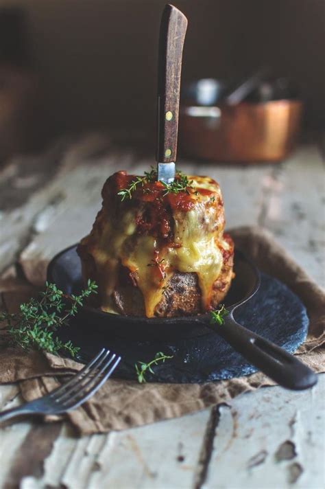 A Plate With Some Food On It And A Knife Sticking Out Of The Top One