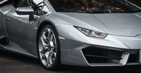 A Silver Lamborghini Huracan on a Street · Free Stock Photo