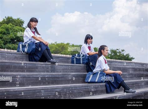 Junior High School Students Sitting On The Stairs Stock Photo Alamy