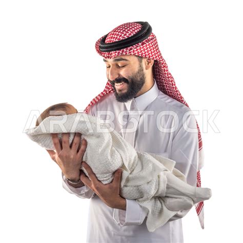 Portrait Of A Happy Father Holding His Infant Son In His Arms And