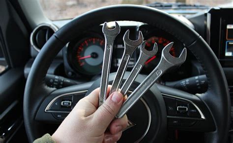 Premium Photo Mechanic Holds A Bunch Of Variety Wrenches In Front Of