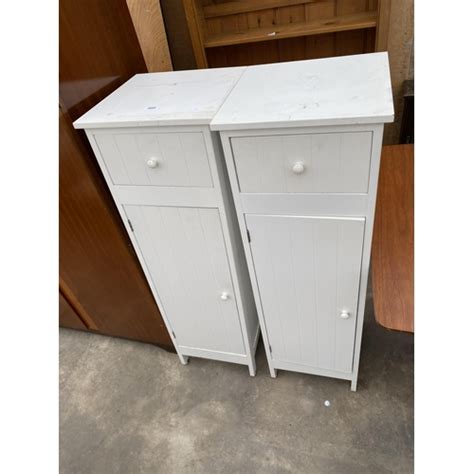 A Pair Of Tall White Cabinets With Single Drawer 145 Wide 45 High