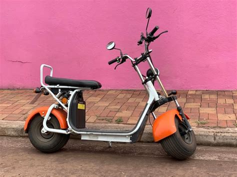 Premium Photo Motor Scooter Parked Against Pink Wall On Santa Cruz