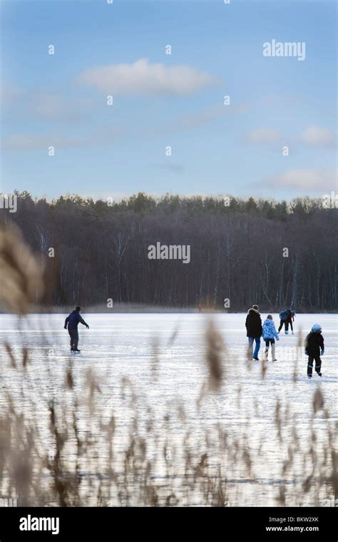 Ice Skating On Frozen Lake Stock Photos And Ice Skating On Frozen Lake