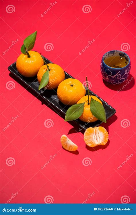 Chinese New Year`s Decoration Mandarin Orange On Red Background Stock