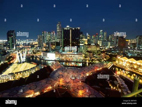 Singapore at night with view of the Singapore River and Clarke Quay ...