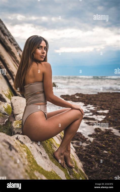 Bikini Model Posing On Rocks Hi Res Stock Photography And Images Alamy