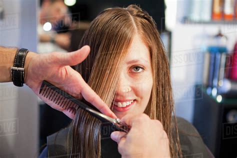 Woman Having Haircut In Salon Stock Photo Dissolve