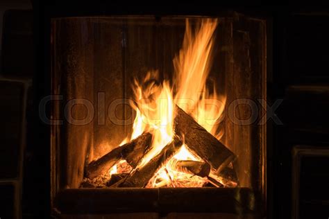 Roaring flames in a modern fireplace | Stock image | Colourbox