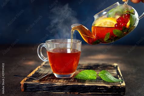 Pouring Herbal Hot Tea In Glass Cup Stock Photo Adobe Stock