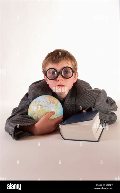 Little Boy With Thick Glasses Globe And Book Stock Photo Alamy