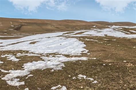 Premium Photo Melting Snow On The Hills In The Foothills Of Kazakhstan