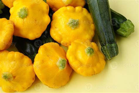 Pattypan Squashes And Baby Marrows On Yellow Background 814951 Stock