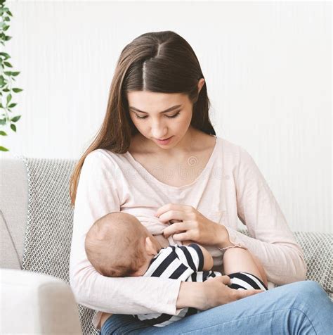 Young Mother Feeding Her Newborn Child with Breast Milk Stock Image ...