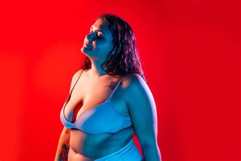 Premium Photo Plus Size Woman Posing In Studio In Lingerie Model On Colored Background Hard