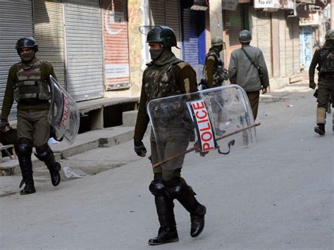 J K Curfew In Rajouri After Communal Tension Army Stages Flag March